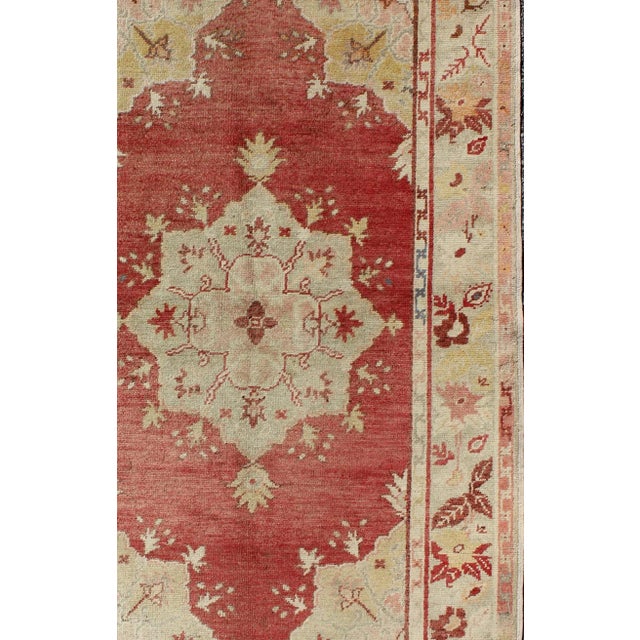 Traditional Mid 20th Century Mid 20th Century Red Field Vintage Turkish Oushak Rug With Geometric Medallion and Floral Motifs For Sale - Image 3 of 7
