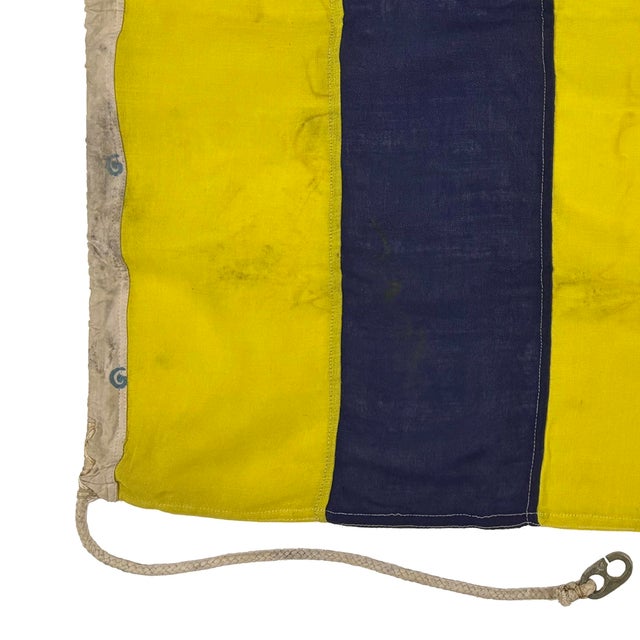 This vintage nautical signal flag is fully sewn from a thin cloth, possibly a blend of wool and synthetic fiber. Please...