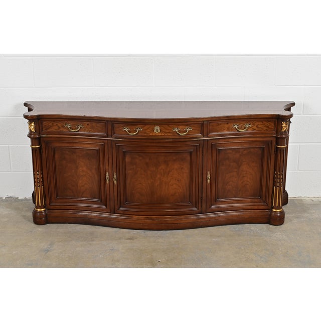 A gorgeous French Empire or French Regency Louis XVI style sideboard, credenza, or bar cabinet By Karges USA, Circa 1980s...