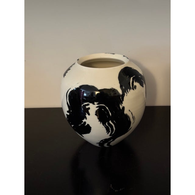 "I work with porcelain, making large vessels and ‘writing’ on them usually with single brushstrokes." "The vessels are...