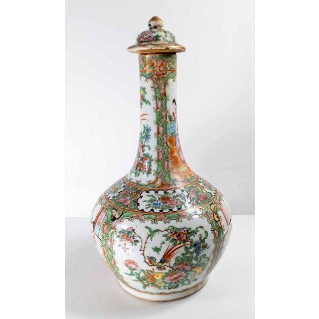 We are selling this nice 19th century Chinese Canton export bottle vase. This bottle vase is a rarer form you don’t see...