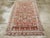 This mid-20th-century Persian Malayer accent rug presents a lively allover floral composition across a soft blue field....
