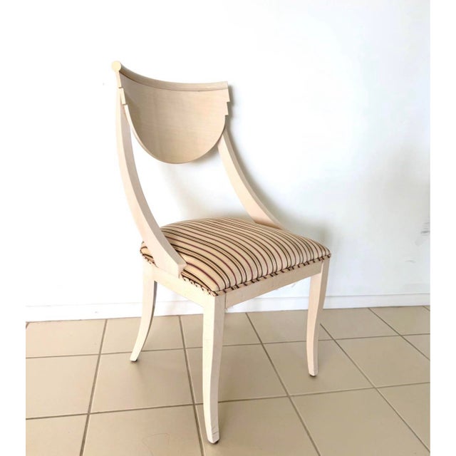 A striking and sculptural set of four authentic vintage Pietro Constantini dining chairs featuring the designer’s...