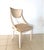 A striking and sculptural set of four authentic vintage Pietro Constantini dining chairs featuring the designer’s...