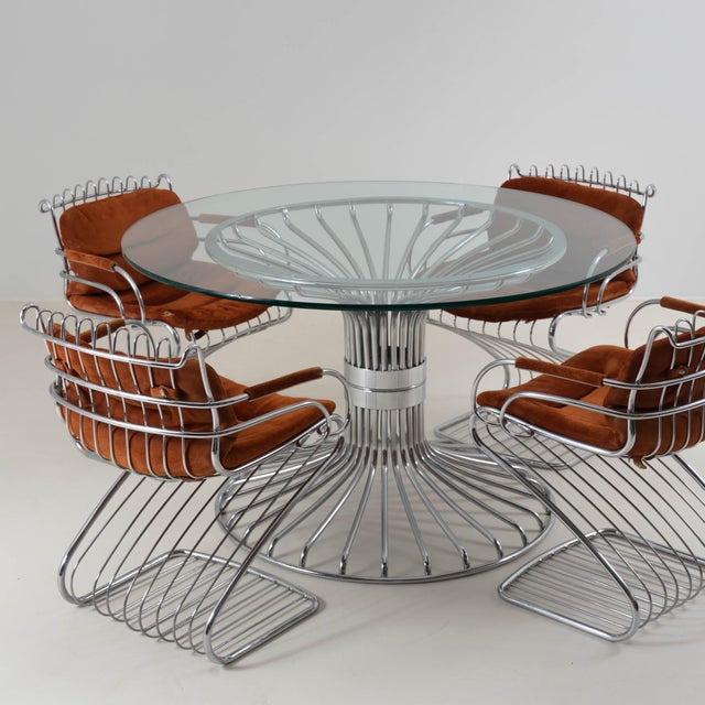 Elegant vintage dining set attributed to Gastone Rinaldi for Rima, Padova, Italy, dating from the 1970s. The set consists...