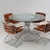 Elegant vintage dining set attributed to Gastone Rinaldi for Rima, Padova, Italy, dating from the 1970s. The set consists...