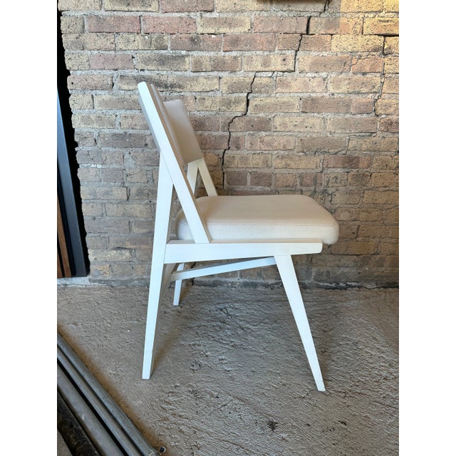 Grand Rapids White Chair with cushion. Has white wooden frame and white cushion. Strong structure