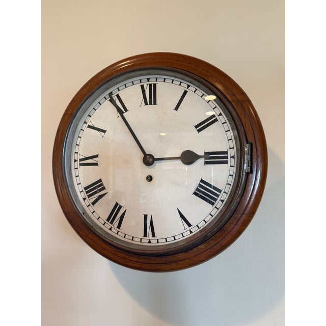 A beautifully aged antique schoolhouse-style regulator wall clock dating to the early 1900s. This classic mechanical wall...