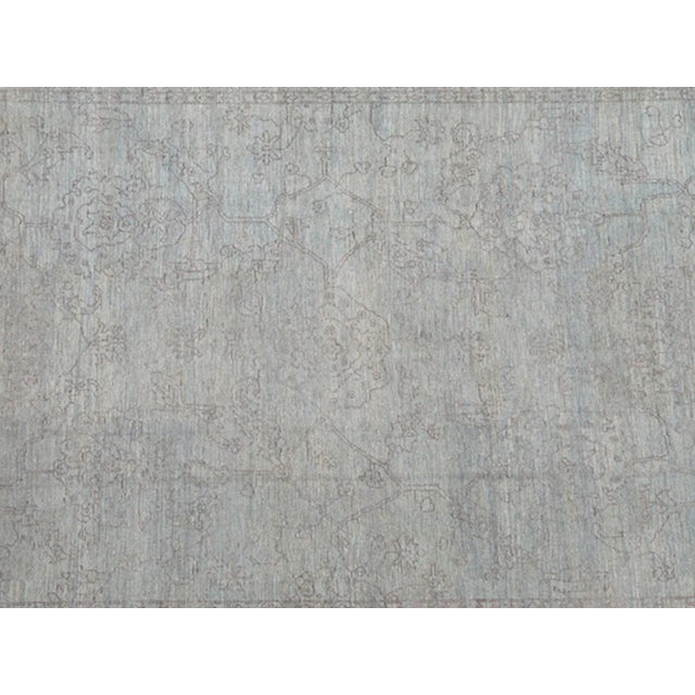 Light lavender and very finely woven Transitional rug in light blue background of lavender highlights. Keivan Woven Arts...