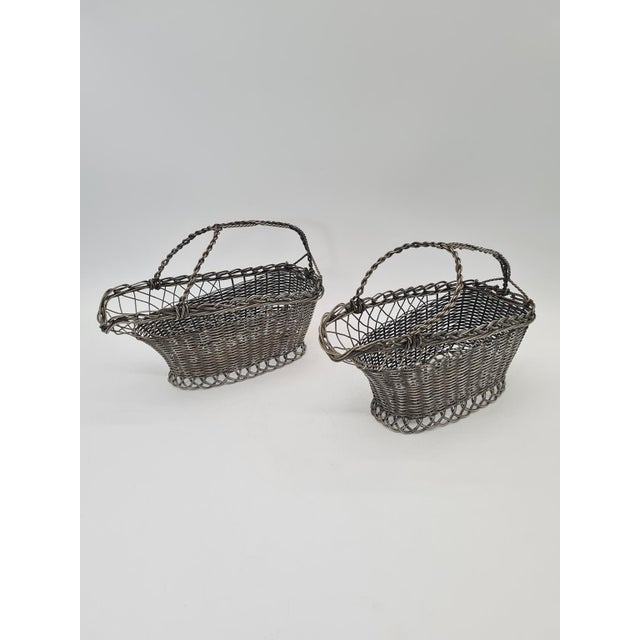 An original set of two decorative bottle-serving baskets—most commonly used for wine or liqueurs. Handcrafted from woven...