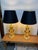 Design Plus Gallery presents a Pair of Sculpted Table Lamps with Regency Style. The lamps are dynamic with golden tall...