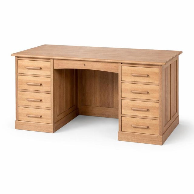 A solid and practical vintage twin pedestal desk crafted from a combination of pine and oak. Featuring eight spacious...