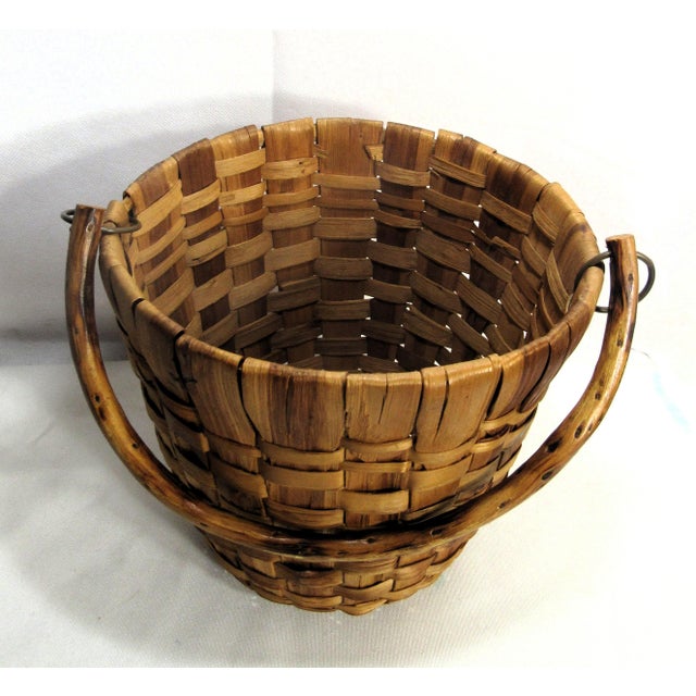 This is an charming old wood slat basket, possibly maple, unique bent wood handle, and just a really nice look about it....
