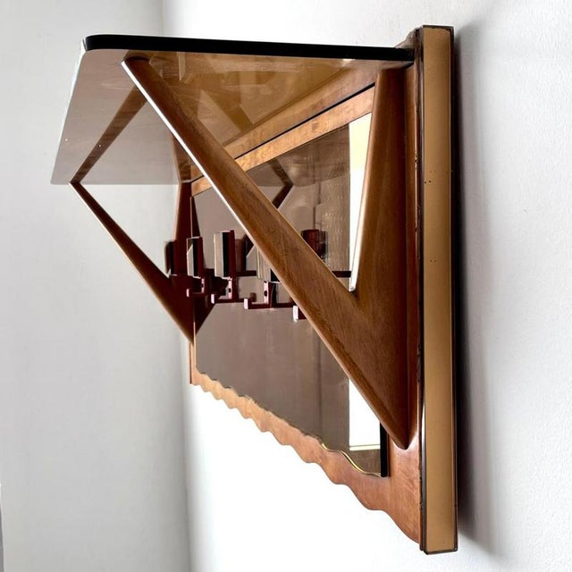 Coat rack with mirrored parts and glass hat shelf, 1940s/50s. The clean, square lines with curved details give it a touch...