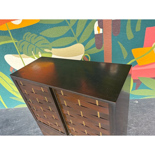 Uniquely designed tallboy with bent woven door fronts with brass detailing. Harvey Probber was known for their timeless...