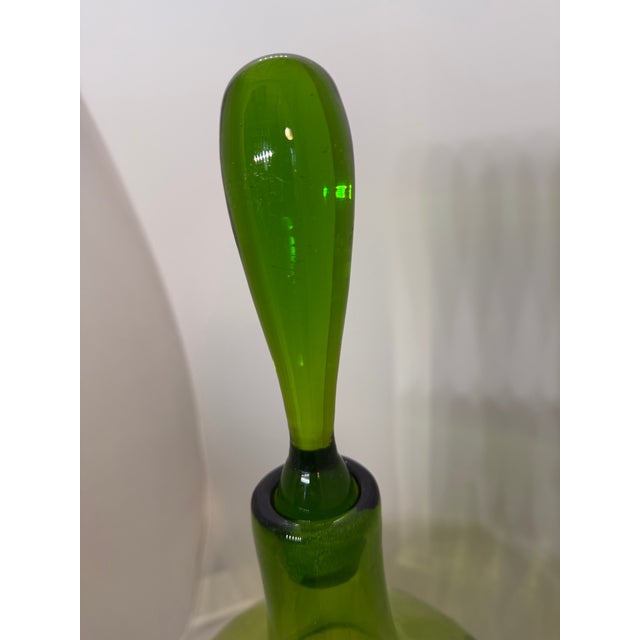 This incredible Blenko decanter has its original label and is in original, pristine condition. It is listed in the Blenko...