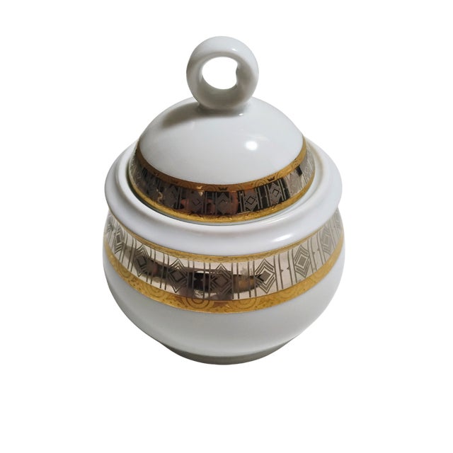 This elegant Fine Bohemian Porcelain covered sugar bowl by Thun Carlsbad features an exquisite, reflective band of...