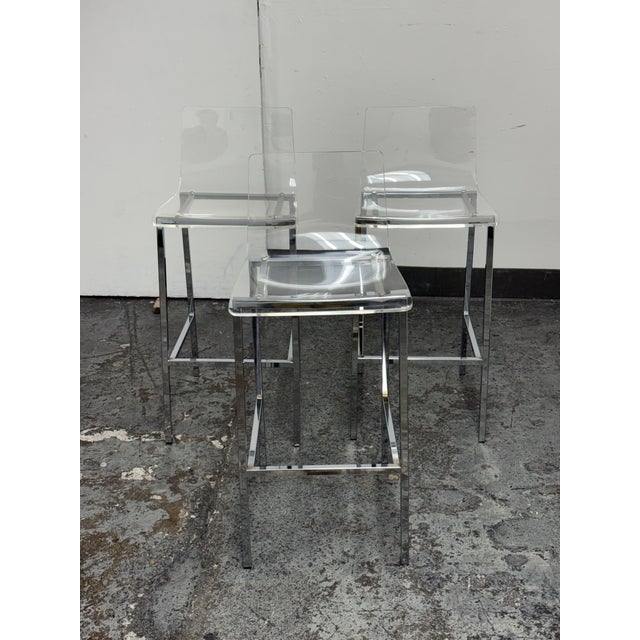 Design Plus Gallery presents a Set of Three Vapor Acrylic Barstools from CB2. Each barstool has a transparent molded...
