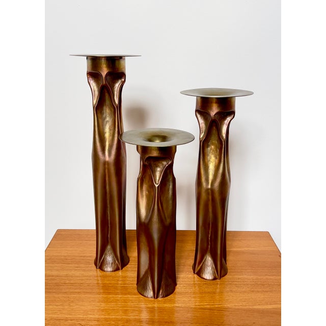 Set of three patinated copper candle holders, hand crafted and stamped by Thomas Roy Markusen. Brutalist style, but also...
