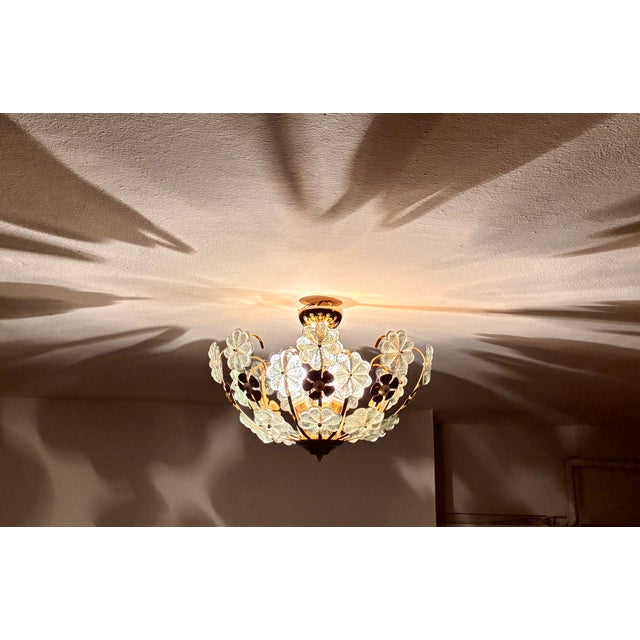 Add timeless elegance and mesmerizing ambient shadows to your home with this unique hand-painted floral flush mount...