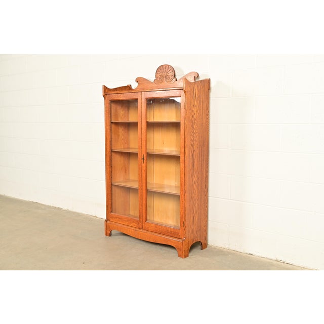 A gorgeous antique Victorian or Arts & Crafts two-door bookcase cabinet By Skandia Furniture Company USA, Circa 1920s...