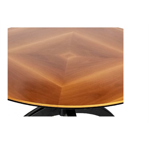 Italian Mid-Century Giorgetti dining table on wheels from 1980's. The dining table is in black painted wood base with...