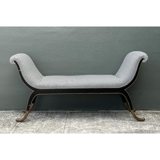 This elegant vintage bench captures the timeless sophistication of Empire and Neoclassical design. Featuring a graceful,...