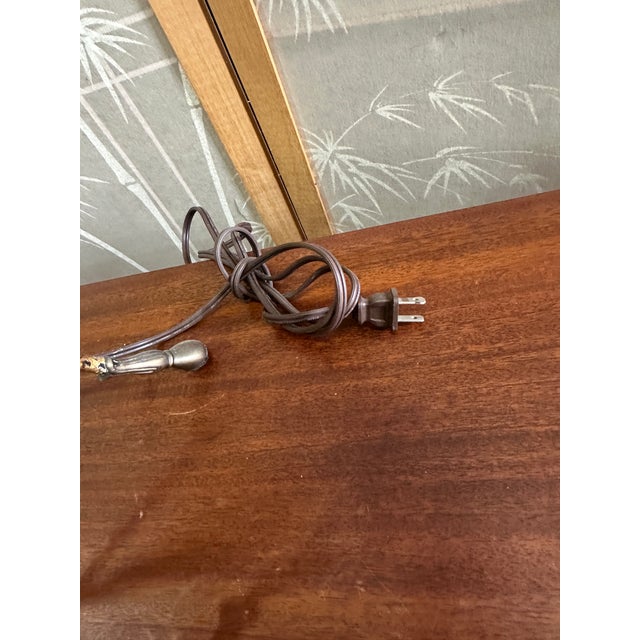 Up for consideration is a beautiful vintage brass colored, urn style, footed table lamp with Greek key and ram head...