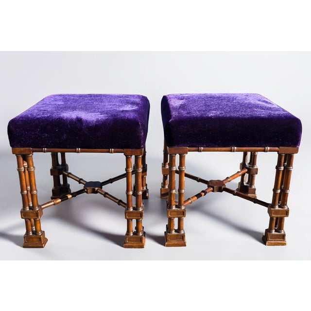 A refined pair of English Aesthetic Movement stools dating to the late 19th century, crafted in solid walnut and...