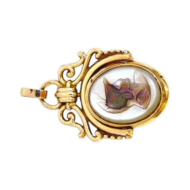 Antique Austro-Hungarian Empire pendant crafted in 14k yellow gold featuring a mother of pearl cameo with intricately...