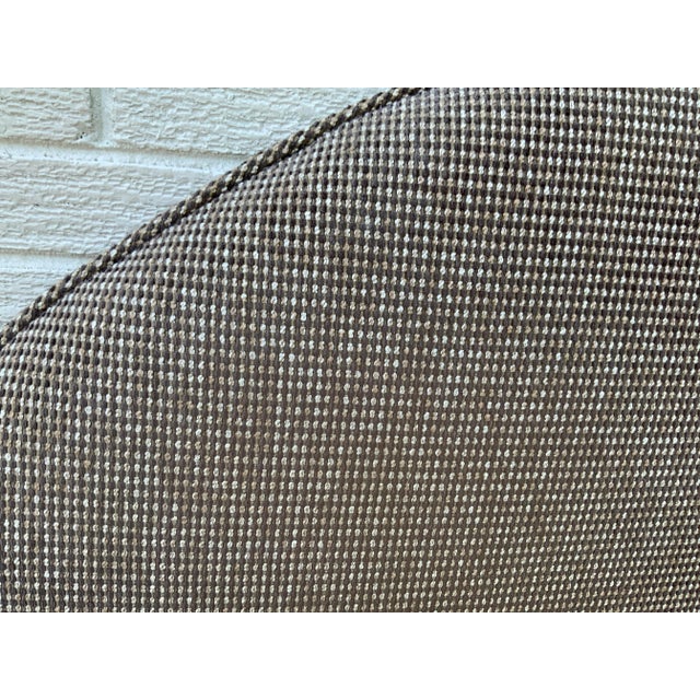 This custom-made queen size headboard is upholstered in a classic tan fabric with clean, English Traditional lines that...