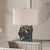 The Prisma Table Lamp Features A Faceted Ceramic Base Covered In A Metallic Smoky Bronze Glaze With Dark Teal Undertones,...