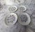 Here is a darling vintage set of four miniature 3.75" butter pats featuring a spring and summer floral design on white...