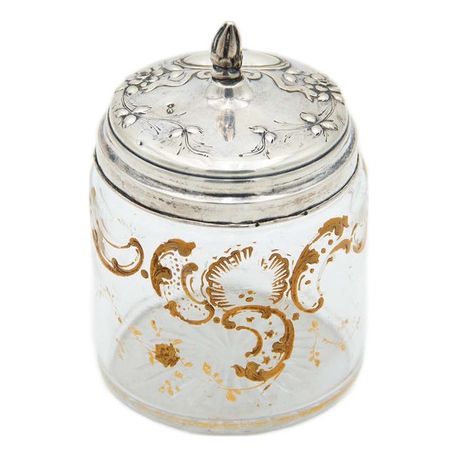 Cut and Gold-Painted Glass Bottle with a Silver Lid Featuring Embossed Floral Motifs For Sale