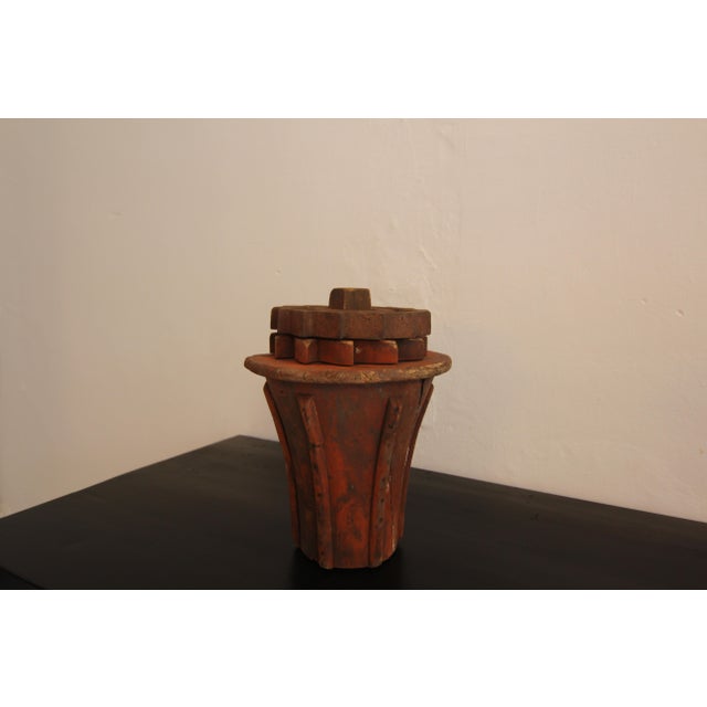 A early 20th century wooden casting pattern. Probably as part of a drive shaft. Shaft in the shape of an inverted blunted...