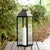 Illuminate your outdoor spaces with the RUANE lantern, a striking 25.5 inch tall lighting solution that combines sleek...