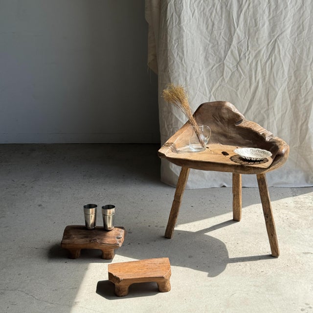 Small stool/footrest in organic, wabi-sabi style, carved from a single piece of blond teak. A charming, modular, Japanese-...