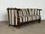 This sofa is built in solid oak in the Renaissance Revival style, likely produced in Denmark in the early 20th century....