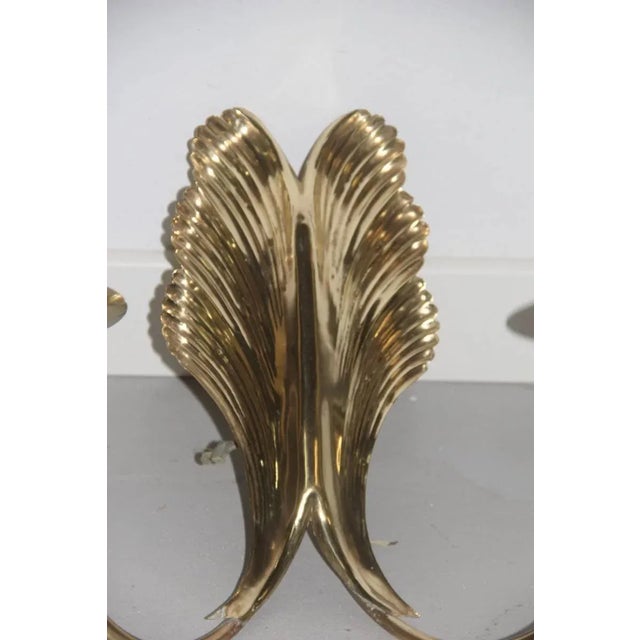 These original brass sculptural wall sconces of Mid-Century Italian design are made of embossed brass. They have a...