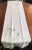 Beautiful white German linen table runner printed with grey cones. Measures 40cm x 150cm. Table in image is 48” rd. For...