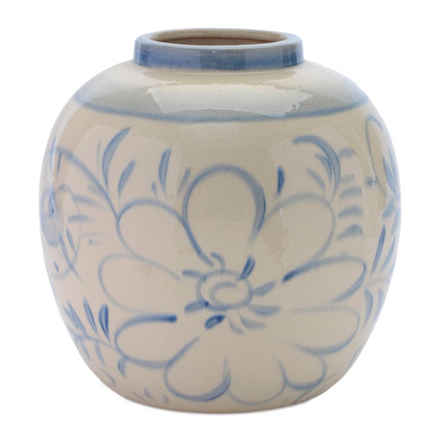 Add a touch of timeless charm to your space with this Blue Floral Stoneware Decorative Container. Showcasing a floral...