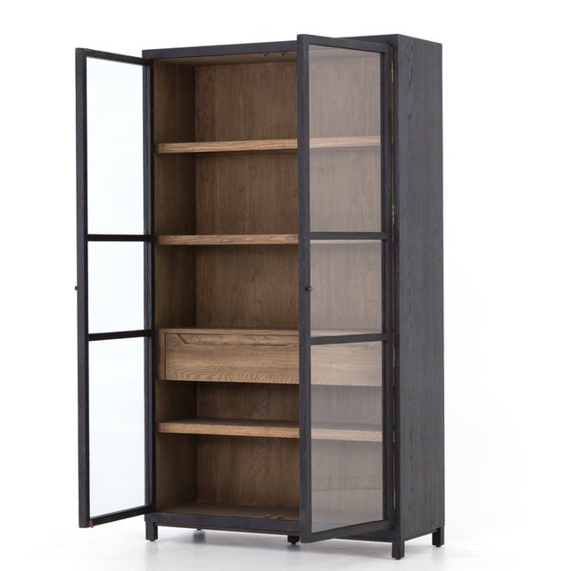 Beautiful Glass Storage Cabinets from Four Hands. Black drifted oak frames lighter interior shelving for subtle but...
