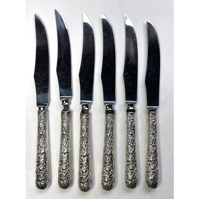 Beautiful set of six steak knives with sterling silver rose and foliage repousse handles and stainless steal blades....