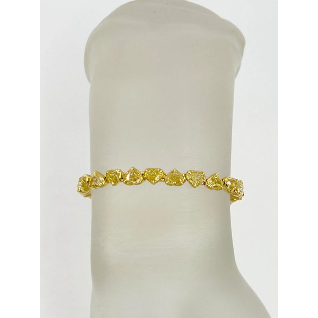 Gorgeous 15.65 ct. yellow diamond heart shapes. Handmade in 18k yellow gold. Length is 7". Total of 30 stones.