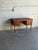 Beautiful vintage Danish Mid-Century Modern writing desk crafted in warm teak with elegant tapered round legs and clean...