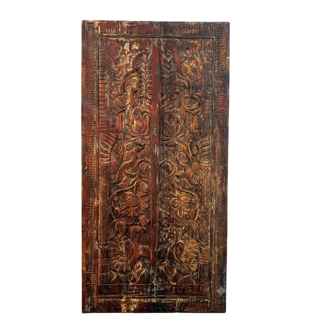 Bring timeless rustic elegance to your space with this beautifully carved antique-style wood door panel featuring a...