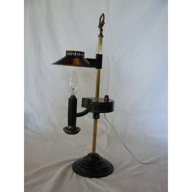 Vintage student desk lamp, a reproduction of earlier oil lamps.Solid, sturdy construction, most likely brass. Shade slides...