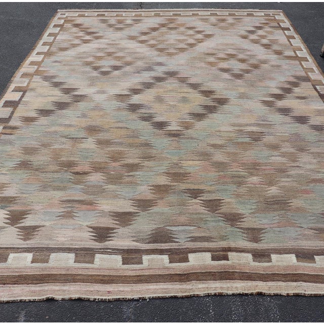 Measures: 9'6 x 15'5 Vintage Turkish Kars Kilim in Soft Taupe, Sage Green, Sand, and Warm Cocoa. Keivan Woven Arts /...