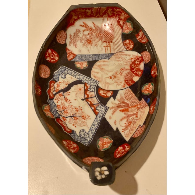 A beautifully hand‑painted Japanese Imari porcelain dish dating to the Meiji Era, showcasing the classic palette of cobalt...