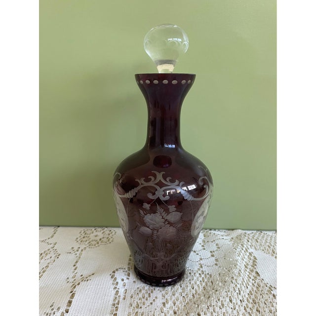 The Vintage Bohemian Crystal Decanter Set from Czechoslovakia features a beautifully crafted crystal decanter and five...